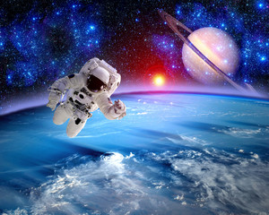 Wall Mural - astronaut spaceman saturn planet