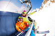 © Sergey Novikov - Mom with boy on ski lift ropeway chair
