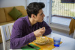 © theartofphoto - Young man enjoying his meal