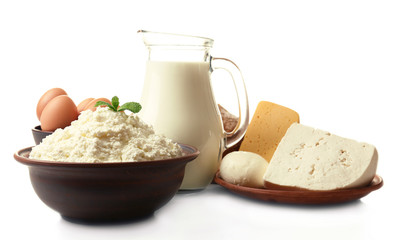 Wall Mural - Dairy products in pottery,eggs and glass jug of milk isolated