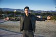 © theartofphoto - Handsome confident trendy young man celebrating freedom