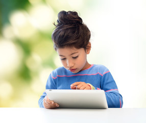 Canvas Print - little girl with tablet pc over green background