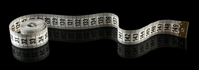 Canvas Print - Measuring tape on black background