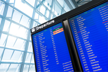 Wall Mural - Flight information, arrival and departure board at the airport