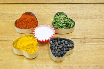 Wall Mural - Black pepper, paprika, curry, basil and salt