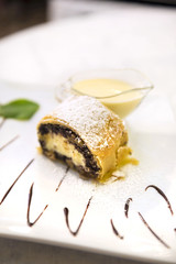 Wall Mural - Poppy seeds and cream cheese strudel with custard and mint