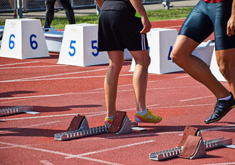 Runners at the starting line of the running track