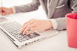 © Nonwarit - Closeup of businessman hands typing on laptop computer