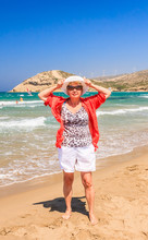 Woman On The Beach Of The Isthmus Prasonisi. Rhodes Island. Gree