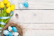 Easter Background With Blue And White Eggs In Nest And Yellow Tu