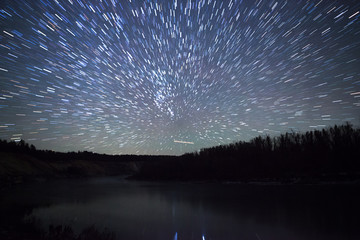 Wall Mural - a beautiful night sky, the milky way, star trails and the trees