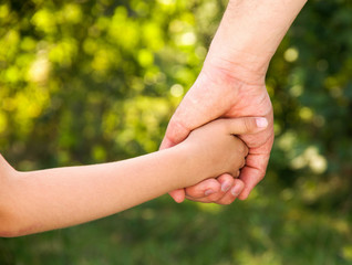 father holding  daughter hand