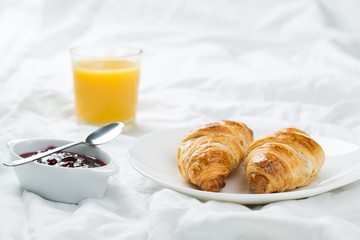 Wall Mural - delicious breakfast with croissants in bed