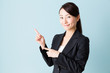 © taka - asian businesswoman on blue background