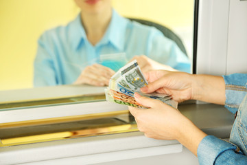 Wall Mural - Teller window with working cashier