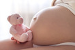 © ondrooo - pregnant belly with teddy bear