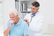 © WavebreakMediaMicro - Doctor examining coughing senior patient