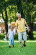 © .shock - grandfather and child have fun  in park