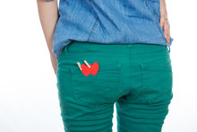 A Woman In A Jeans A Red Paper Heart In Back Pocket