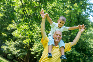 grandfather and child have fun  in park