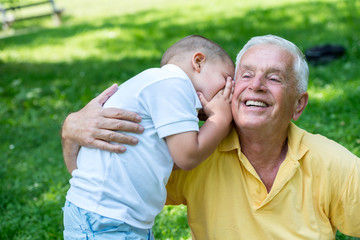 grandfather and child have fun  in park