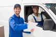 © WavebreakmediaMicro - Delivery driver showing customer where to sign