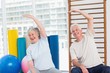 © WavebreakMediaMicro - Senior couple doing stretching exercise in gym