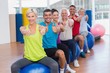 © WavebreakmediaMicro - People gesturing thumbs up in health club