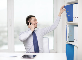 Wall Mural - businessman with smartphone and tablet pc