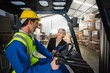 © WavebreakmediaMicro - Warehouse manager talking with forklift driver