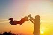 © nadezhda1906 - father and son silhouettes play at sunset