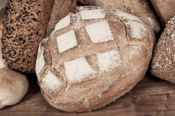 Group of different bread's type on wooden table