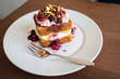 © baimaple - Sponge cake topping with berry and nut