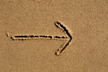 Arrow Drawn In Sand
