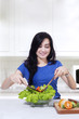 © Creativa Images - Happy woman with healthy meal