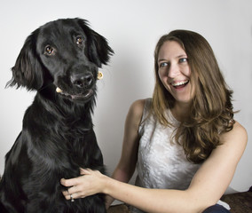 Pretty young woman and black dog