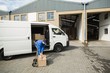 © WavebreakmediaMicro - Delivery driver packing his van