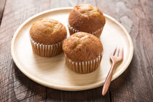 Muffins On A Wooden Table