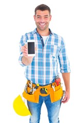 Poster - Portrait of smiling handyman showing mobile phone
