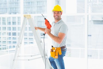 Poster - Repairman with drill machine climbing ladder in building