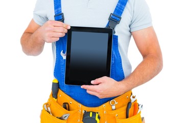 Poster - Midsection of repairman holding digital tablet