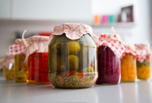 Closeup On Jars Of Pickled Vegetables On Table