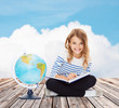 © Syda Productions - girl with globe and book