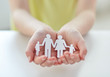 © Syda Productions - close up of child hands with paper family cutout