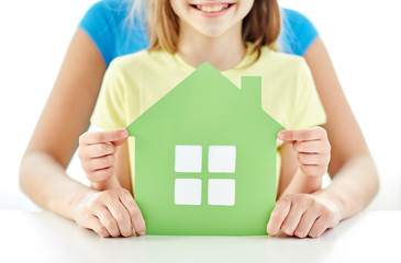 Canvas Print - close up of woman and girl hands with paper house