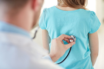 Wall Mural - close up of girl and doctor on medical exam