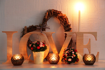 Wall Mural - Romantic still life with wicker heart and candle lights