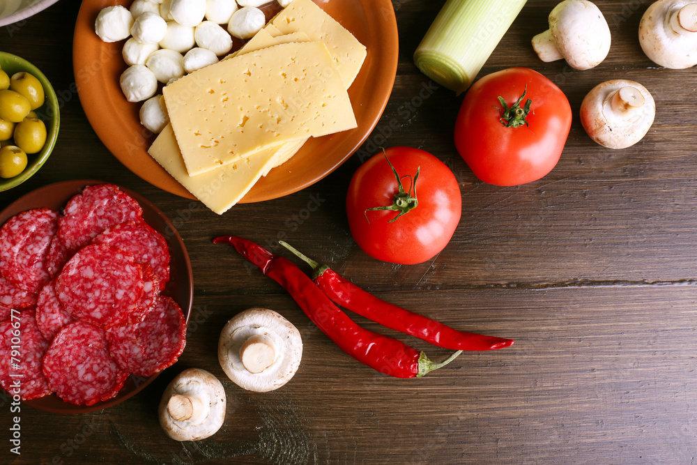 Different products on wooden table close up