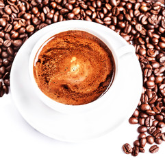 Poster - Coffee cup and saucer with roasted coffee beans isolated on a wh