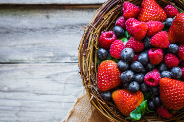 Canvas Print - Berries on wooden background